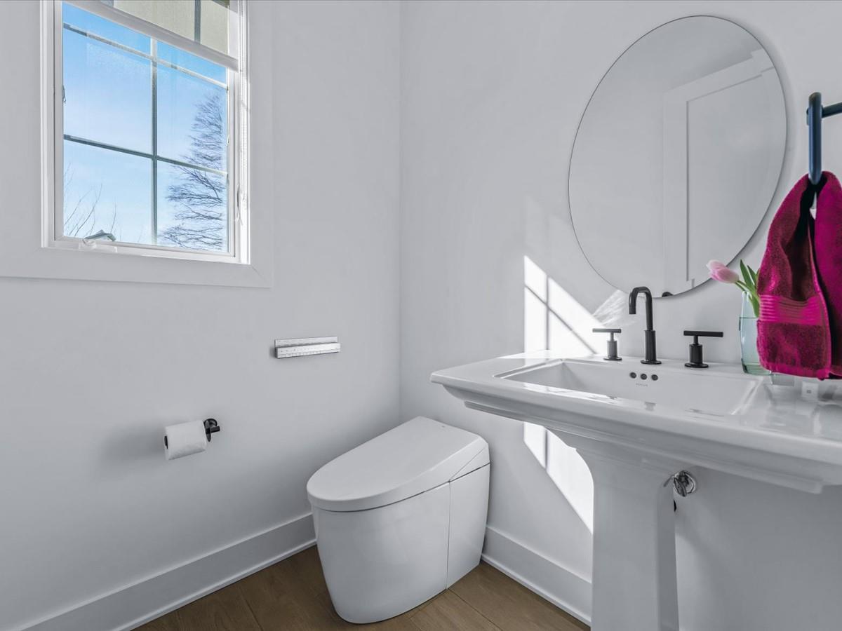 1 Sequoia Circle Manhasset, NY 11030 - Photo 16 of 24 a bathroom with a sink and a toilet