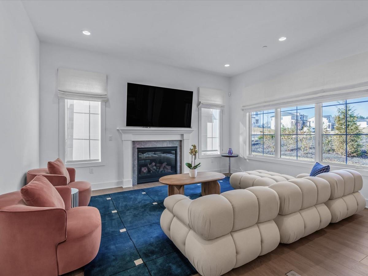 1 Sequoia Circle Manhasset, NY 11030 - Photo 3 of 24 a living room with furniture fireplace and flat screen tv