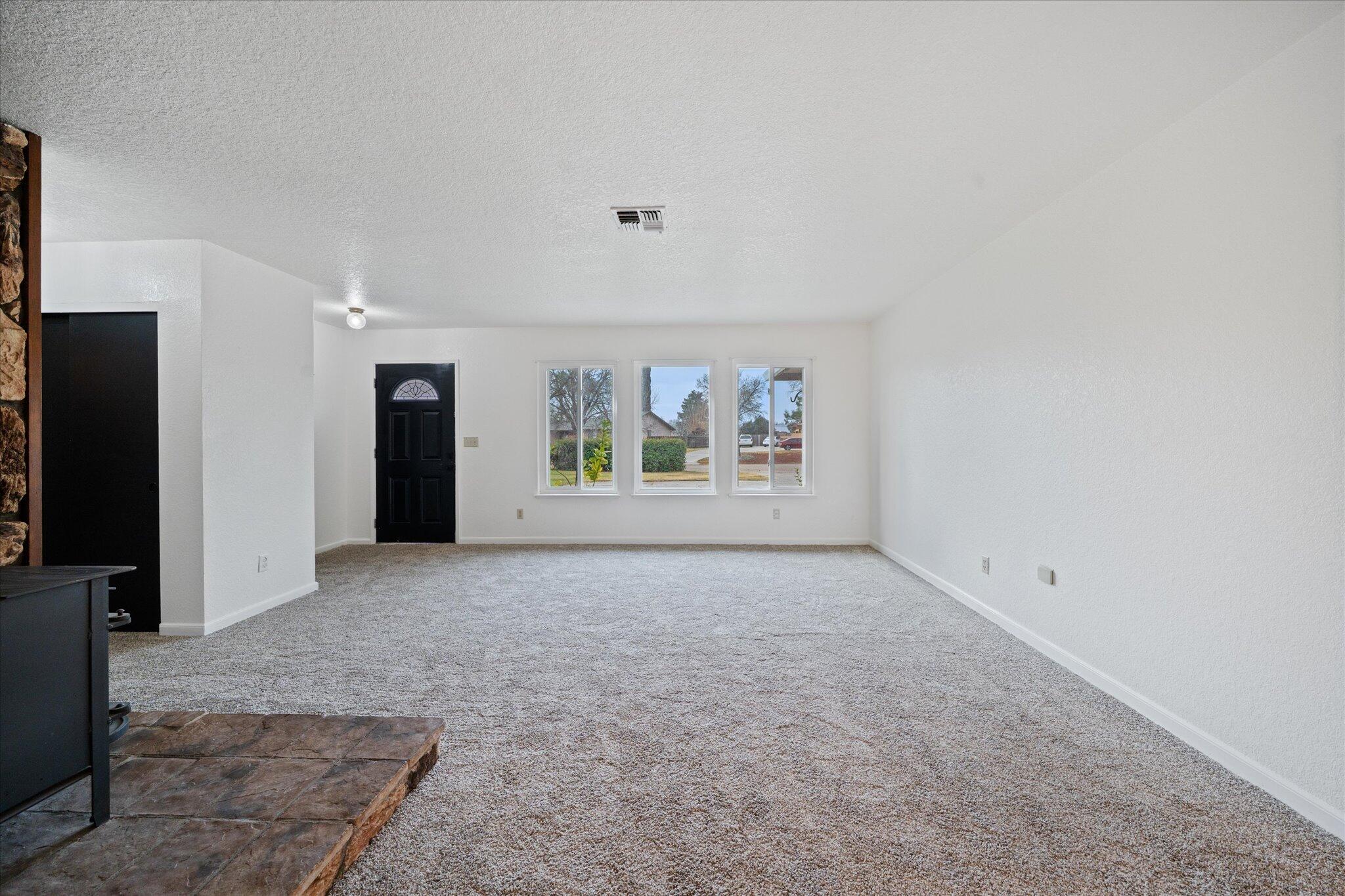 13770 Lisa Way Red Bluff, CA 96080 - Photo 12 of 43 an empty room with windows