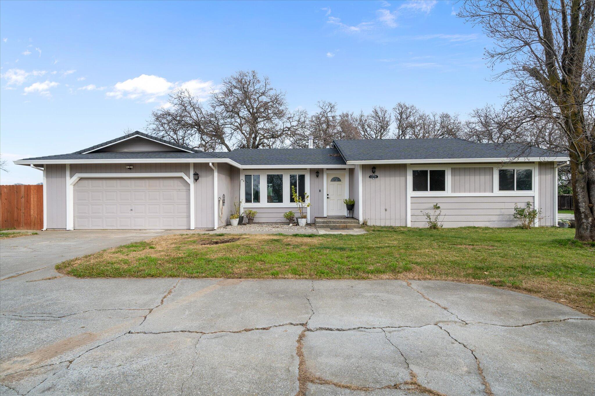 13770 Lisa Way Red Bluff, CA 96080 - Photo 2 of 43 a front view of house with yard and green space