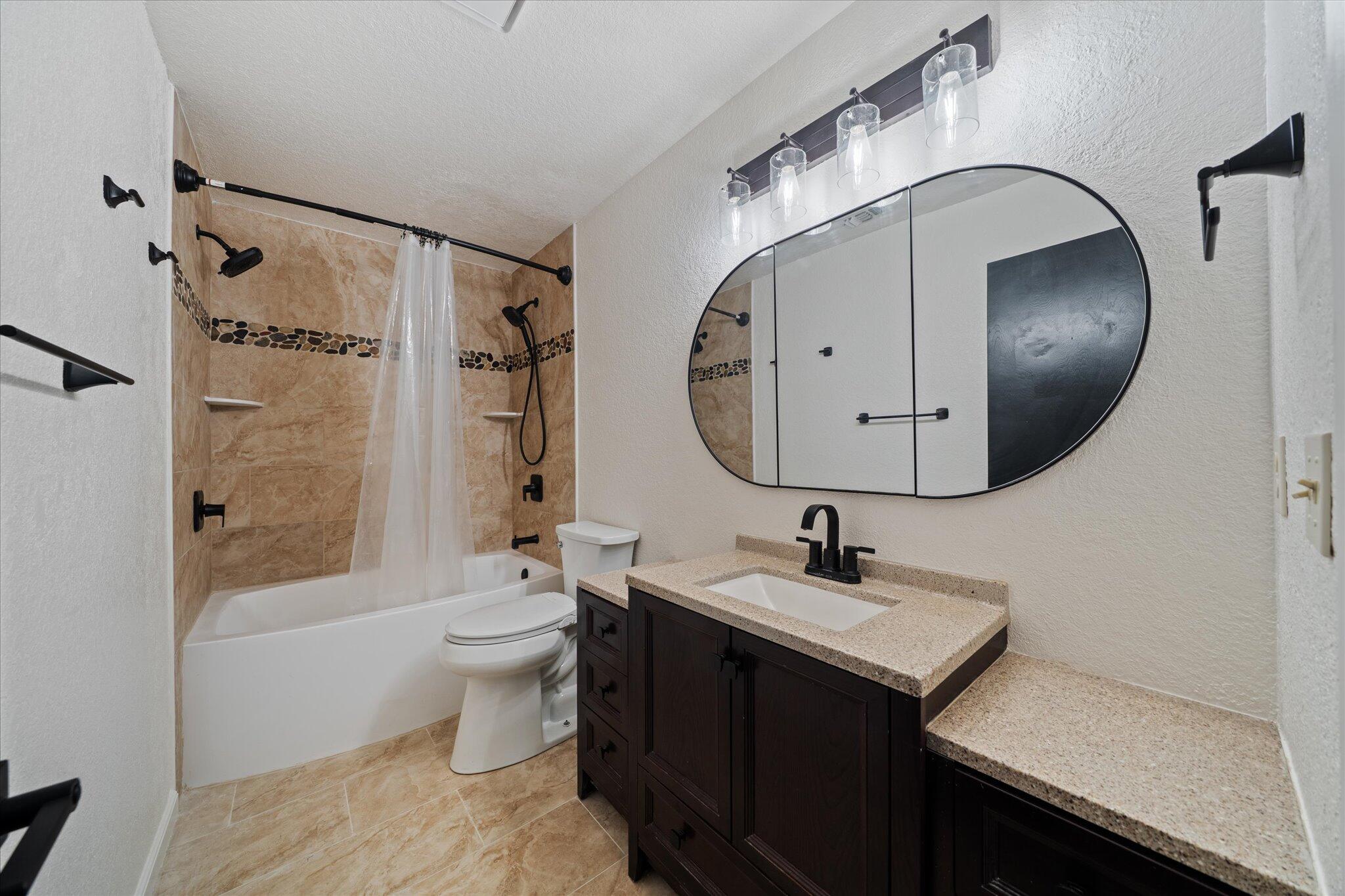 13770 Lisa Way Red Bluff, CA 96080 - Photo 21 of 43 a bathroom with a sink a toilet and shower