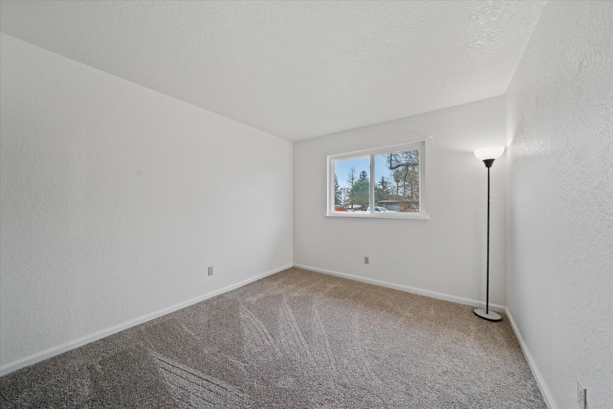 13770 Lisa Way Red Bluff, CA 96080 - Photo 25 of 43 an empty room with windows