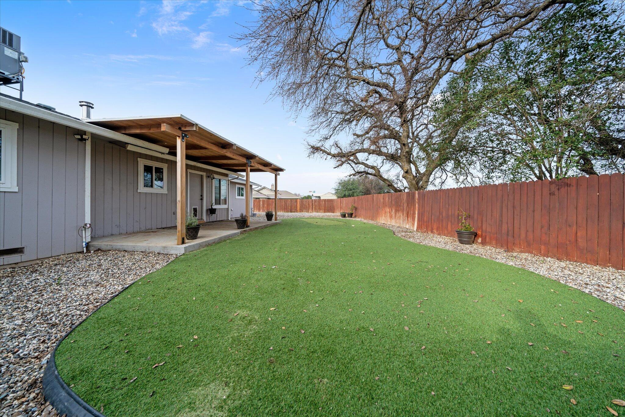 13770 Lisa Way Red Bluff, CA 96080 - Photo 31 of 43 a view of a house with a backyard