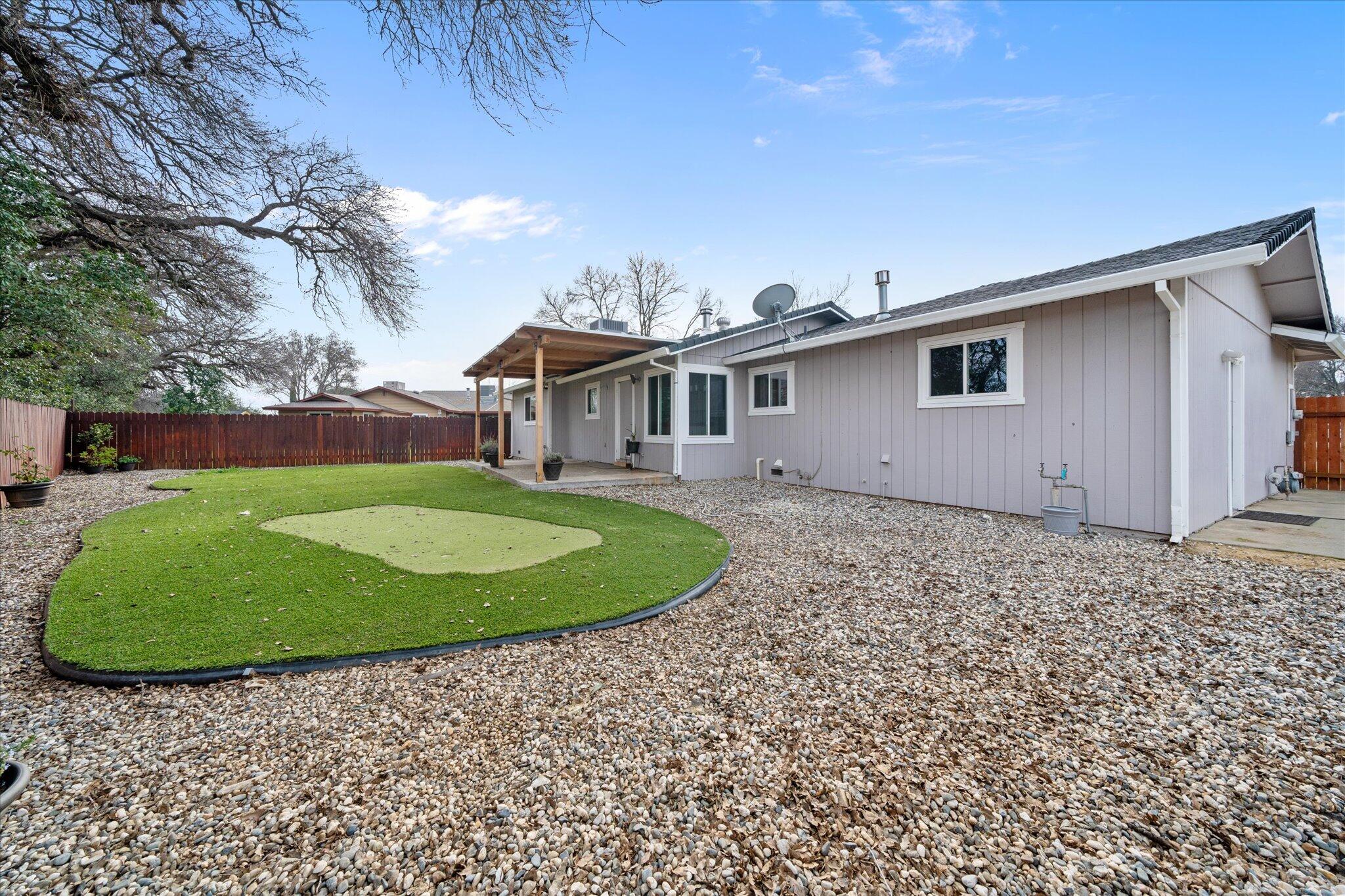 13770 Lisa Way Red Bluff, CA 96080 - Photo 33 of 43 a view of a house with a backyard