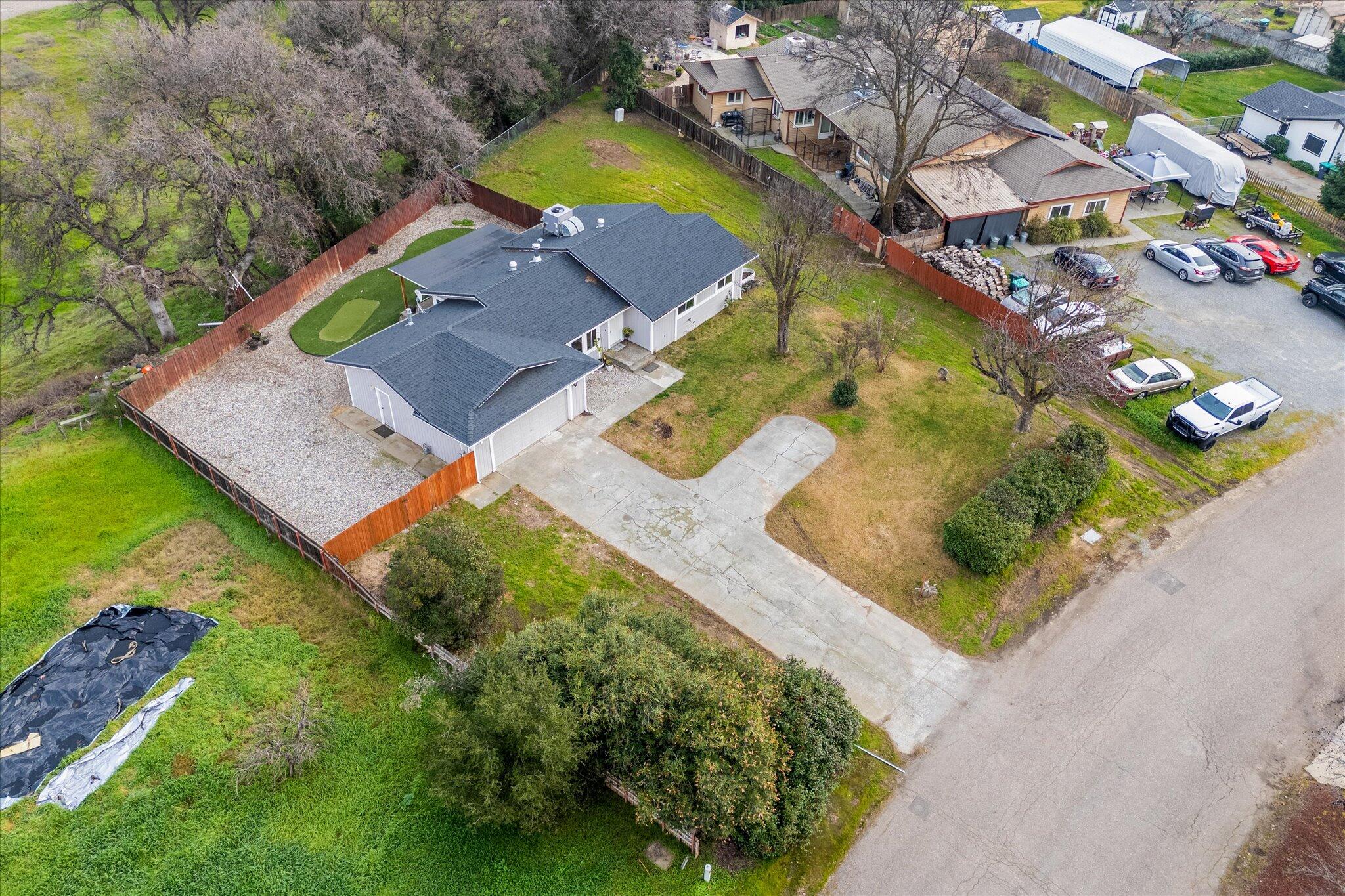13770 Lisa Way Red Bluff, CA 96080 - Photo 38 of 43 an aerial view of a house with a swimming pool