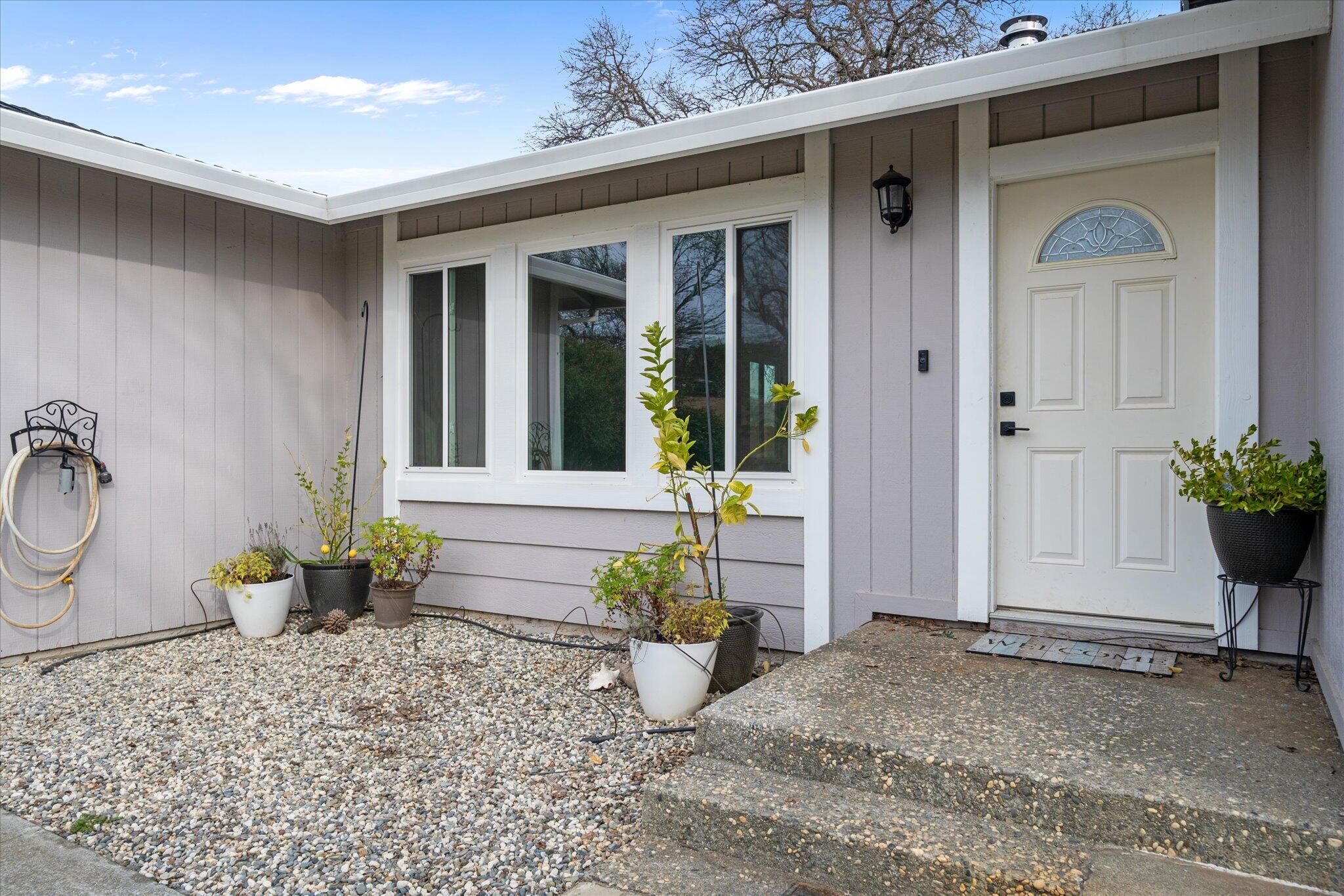 13770 Lisa Way Red Bluff, CA 96080 - Photo 4 of 43 a view of a entryway door of the house