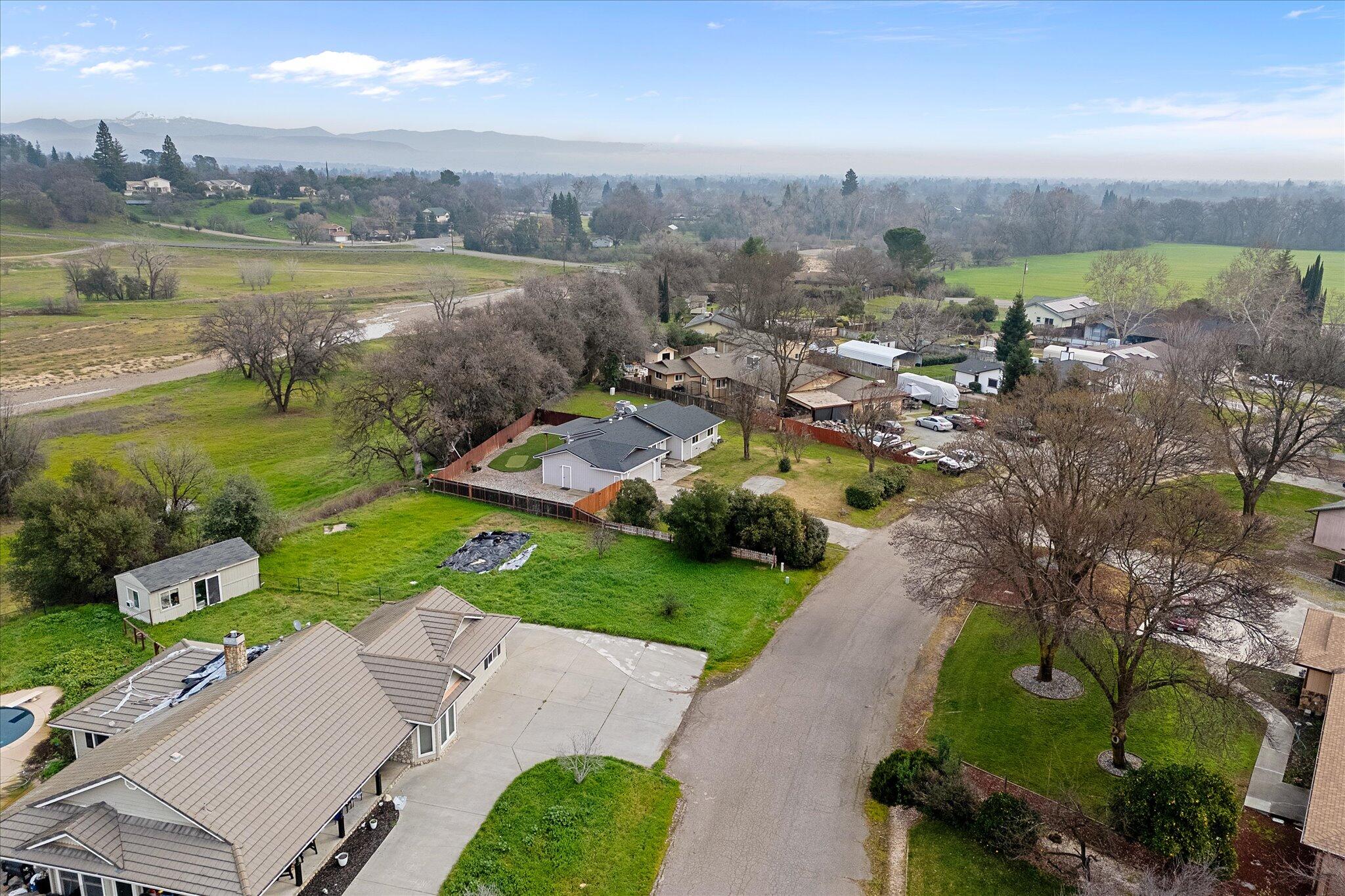 13770 Lisa Way Red Bluff, CA 96080 - Photo 43 of 43 an aerial view of a house with garden space and ocean view
