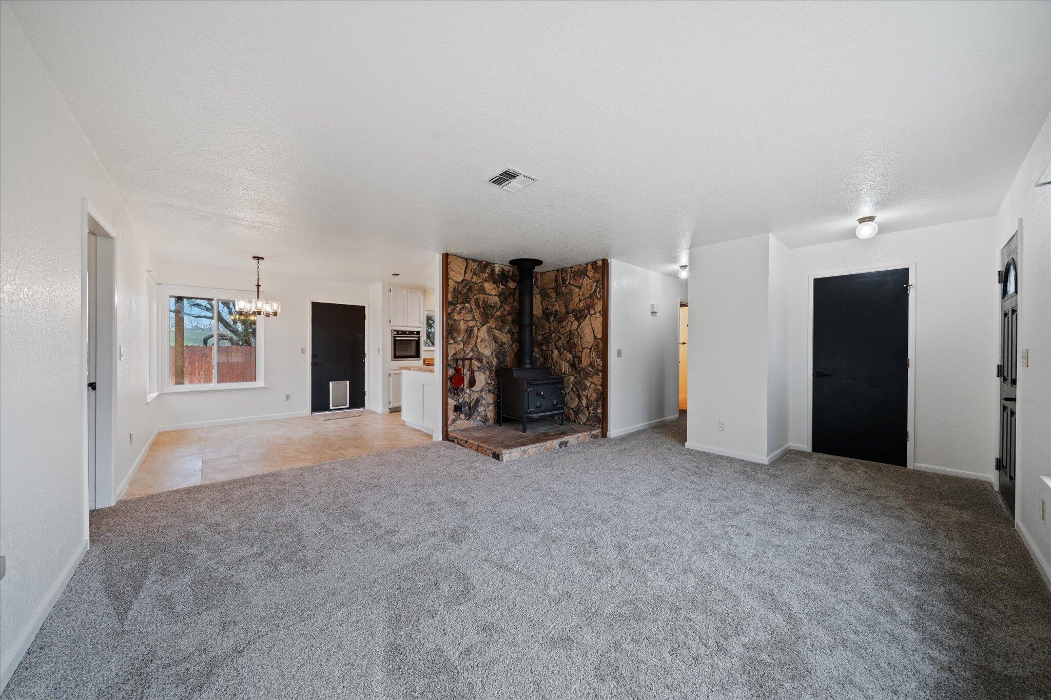 13770 Lisa Way Red Bluff, CA 96080 - Photo 8 of 43 a view of an empty room with closet and cabinet