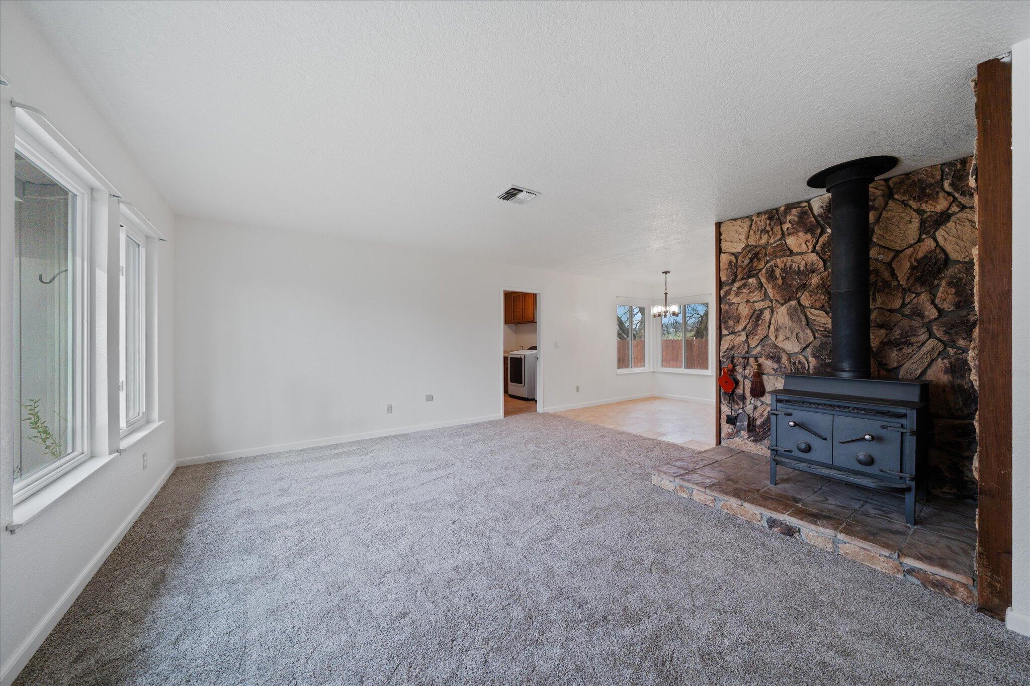13770 Lisa Way Red Bluff, CA 96080 - Photo 9 of 43 a view of an empty room with furniture and window