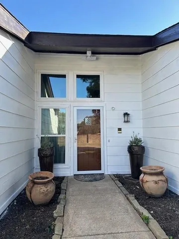 a view of a porch with seating space