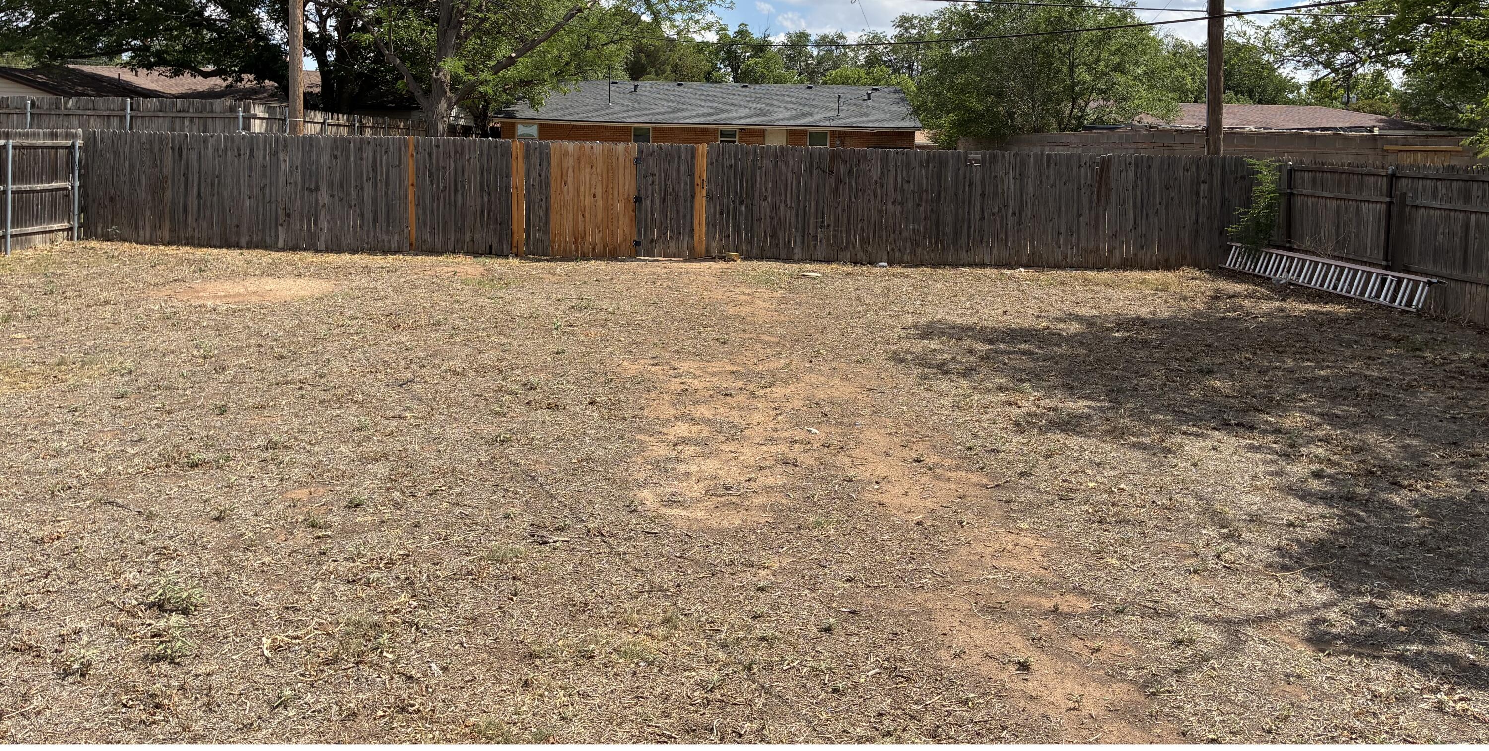 3503 35th Street Lubbock, TX 79413 - Photo 1 of 12 backyard toward back fence