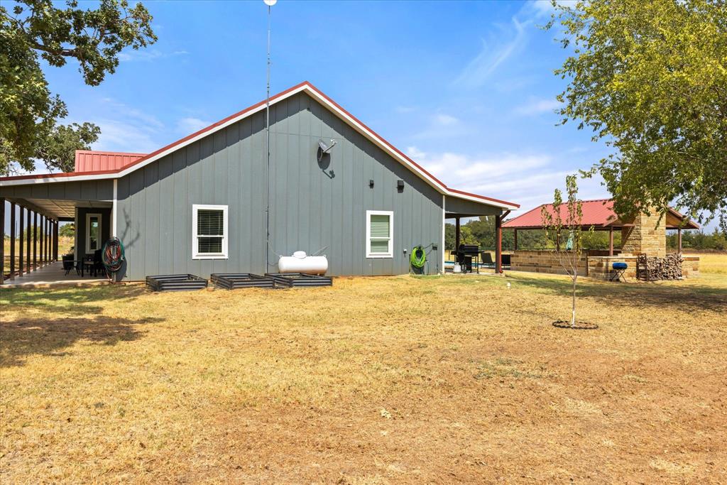 9739 Waldrup Road Lipan, TX 76462 - Photo 4 of 38 Raised garden beds and fruit trees have already been started for you.