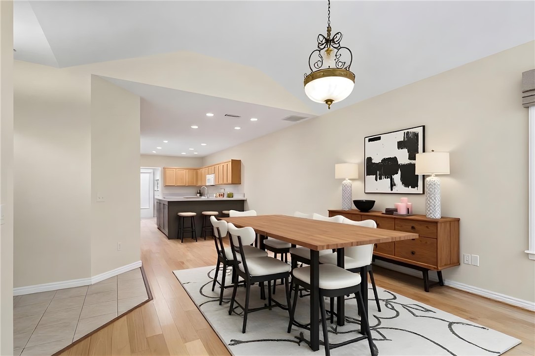 155 Life Style Lane Anderson, SC 29621 - Photo 6 of 49 An inviting dining area offers a glimpse into a well-appointed kitchen, ideal for entertaining.