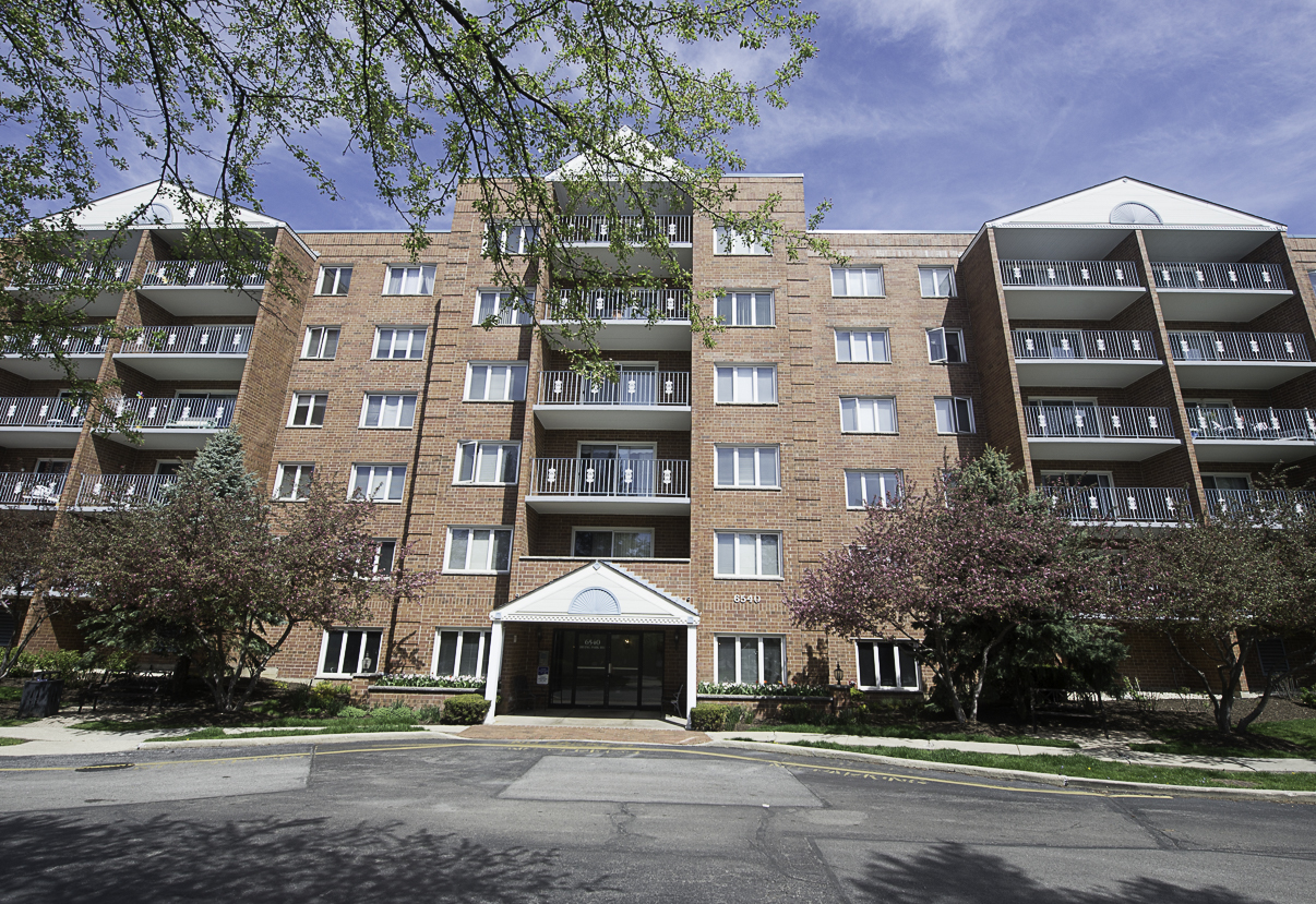 6540 West Irving Park Road, Unit 309 Chicago, IL 60634 - Photo 1 of 18 a front view of a building with street view