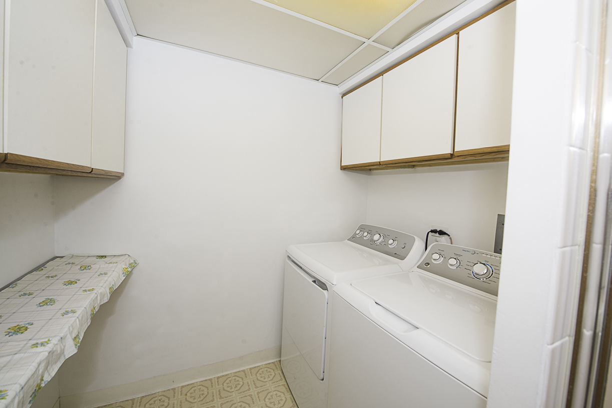 6540 West Irving Park Road, Unit 309 Chicago, IL 60634 - Photo 12 of 18 a utility room with dryer and washer