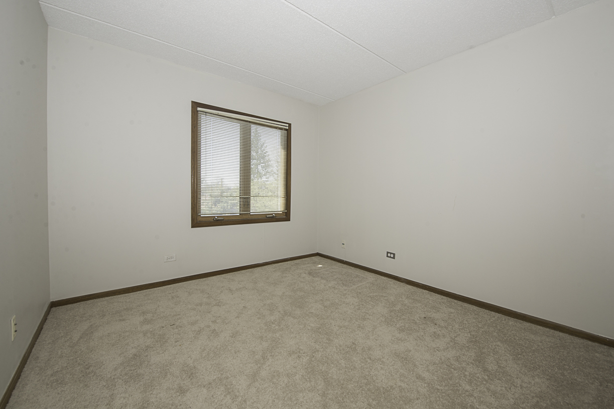 6540 West Irving Park Road, Unit 309 Chicago, IL 60634 - Photo 13 of 18 an empty room with a window