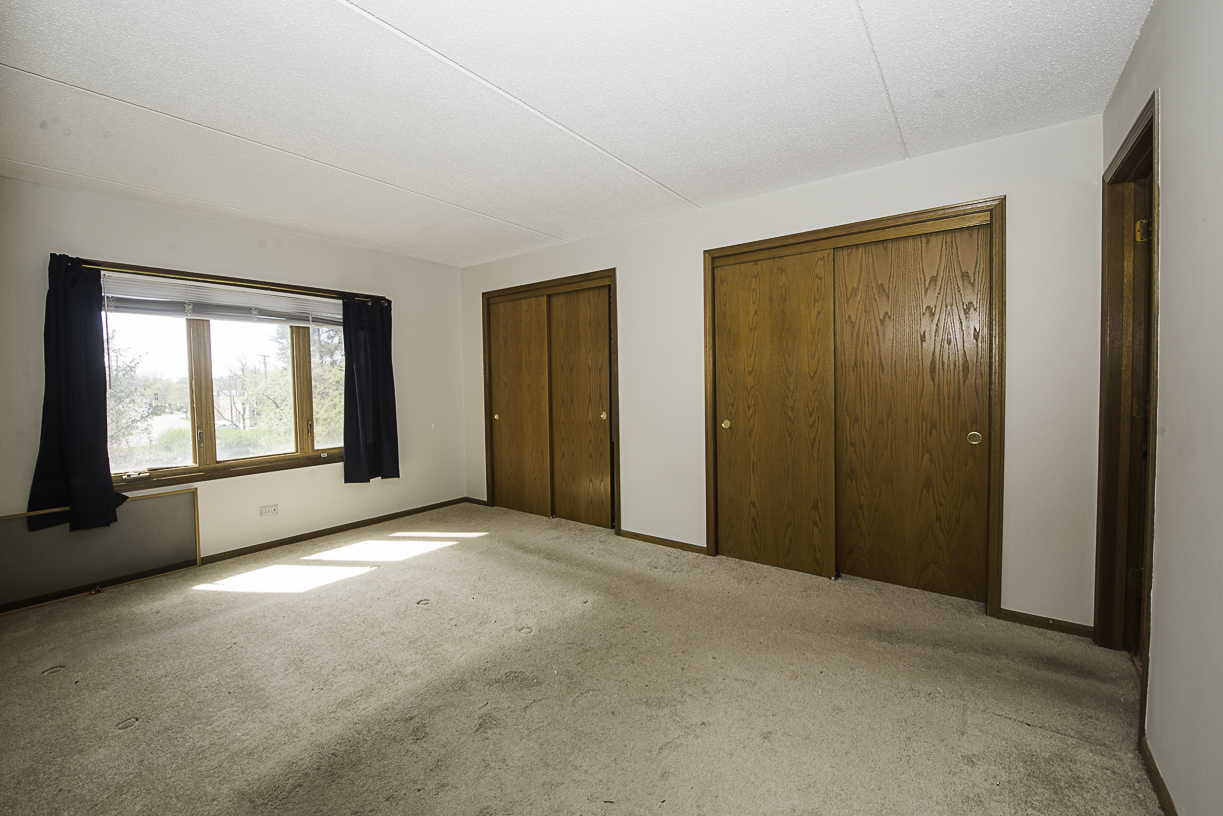 6540 West Irving Park Road, Unit 309 Chicago, IL 60634 - Photo 9 of 18 a view of an empty room with window and bathroom