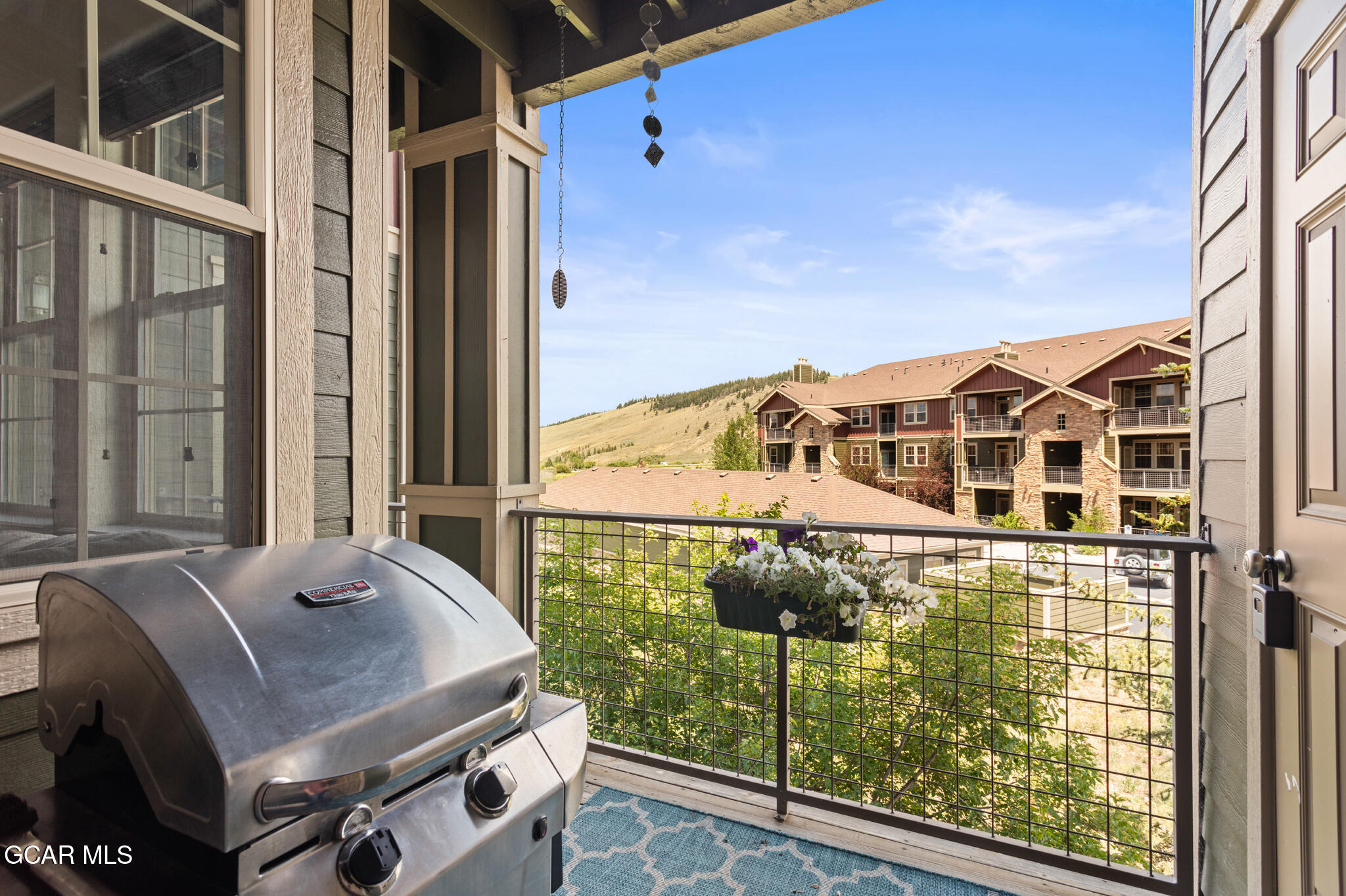 152 Village Road, Unit B206 Granby, CO 80446 - Photo 11 of 30 a balcony with table and chairs