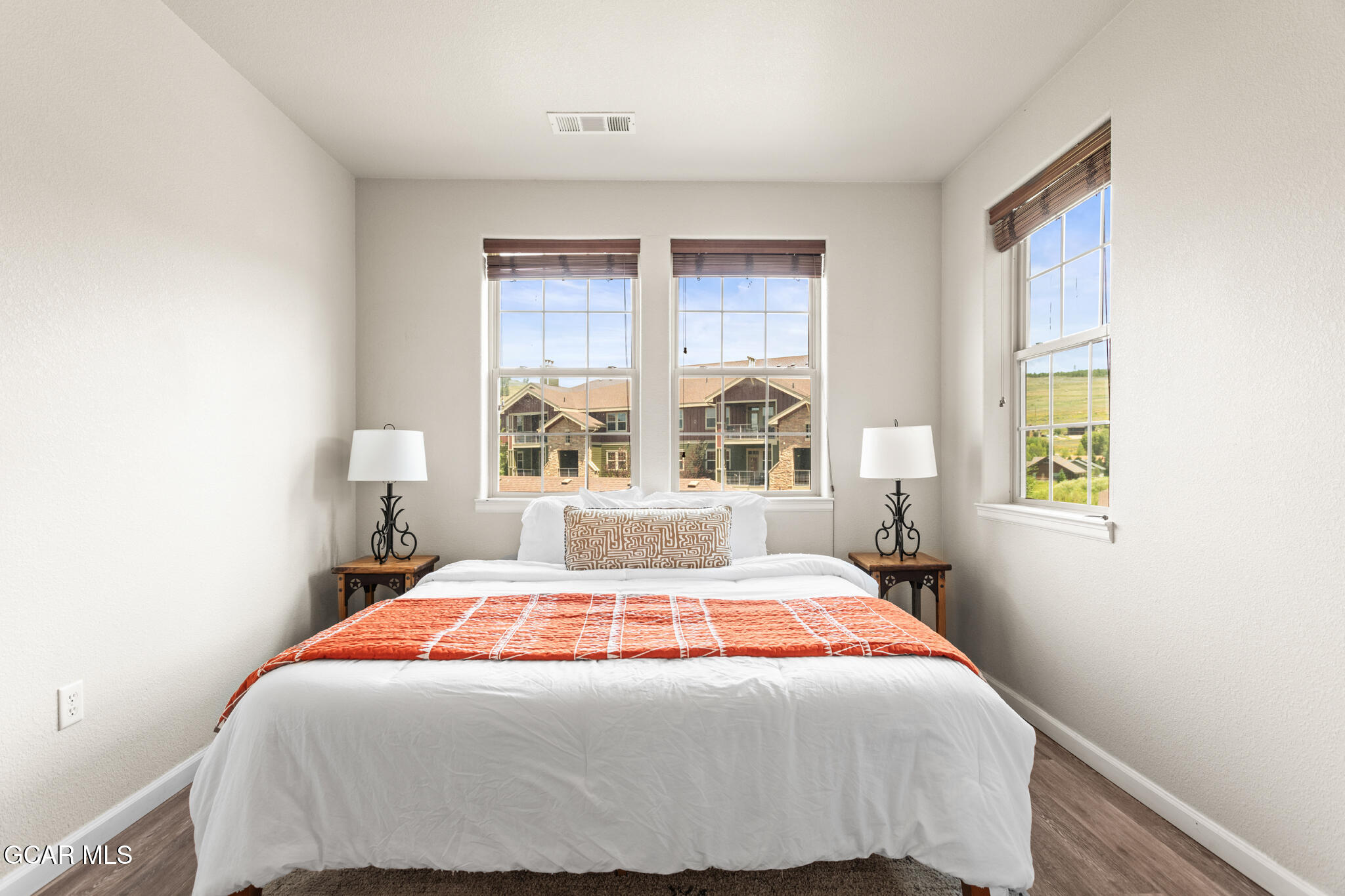 152 Village Road, Unit B206 Granby, CO 80446 - Photo 14 of 30 a bedroom with a large bed and a window