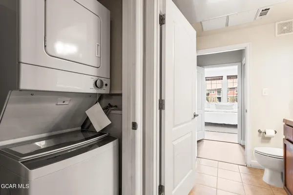 a kitchen with a refrigerator and a sink