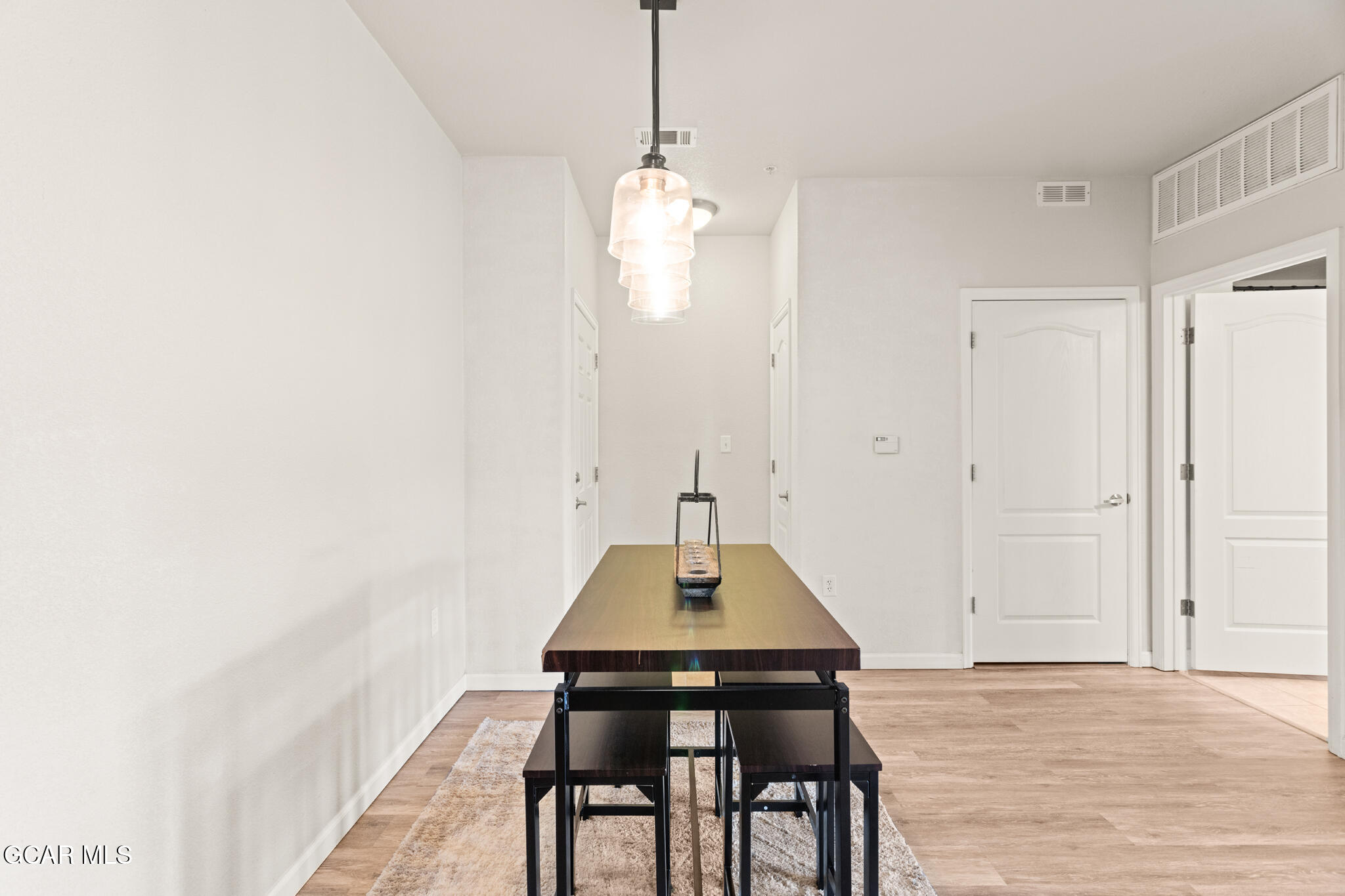 152 Village Road, Unit B206 Granby, CO 80446 - Photo 19 of 30 a dining room with a table and chairs