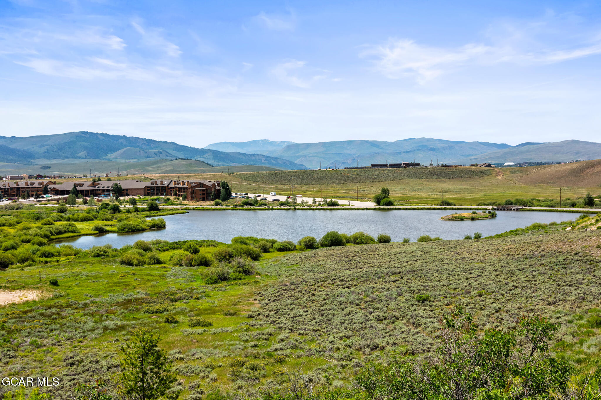152 Village Road, Unit B206 Granby, CO 80446 - Photo 25 of 30 a view of a lake with mountains in the background