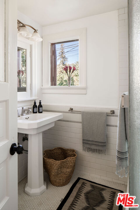 2107 Santa Rosa Avenue Altadena, CA 91001 - Photo 17 of 25 a bathroom with a sink and a mirror