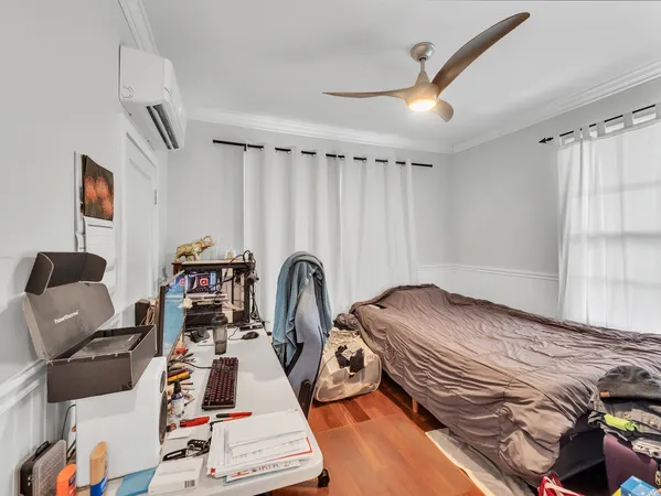a bed room with a bed and a book shelf