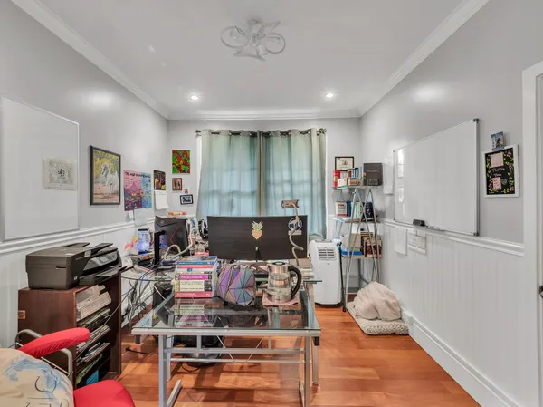 a view of a workspace with furniture and a livingroom