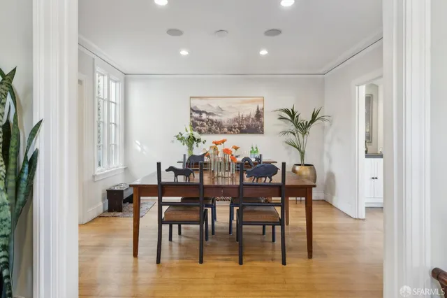 a bath tub sitting in a bathroom next to a window