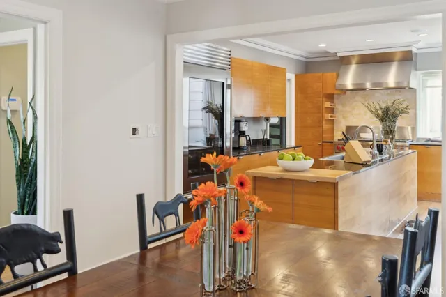 a view of a dining room with furniture and window