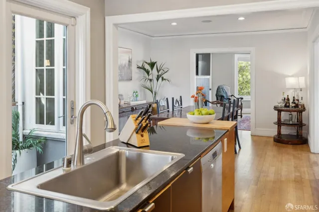 a bathroom with a sink toilet and a mirror