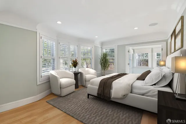 a view of a swimming pool with chairs in patio