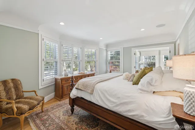 a view of a patio with a table and chairs under an umbrella