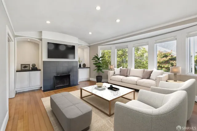 a view of a dining room with furniture and a window