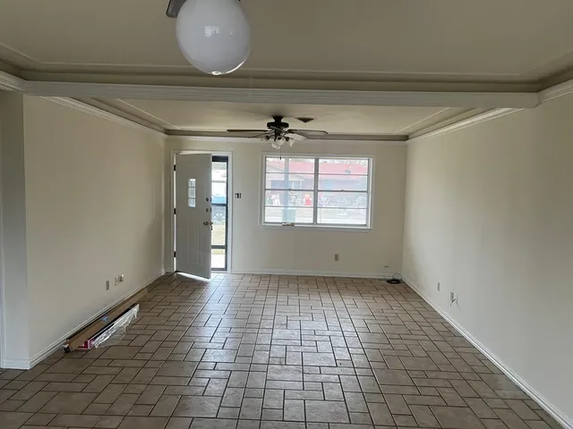 a view of an empty room and window