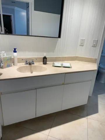 a bathroom with a sink and a mirror