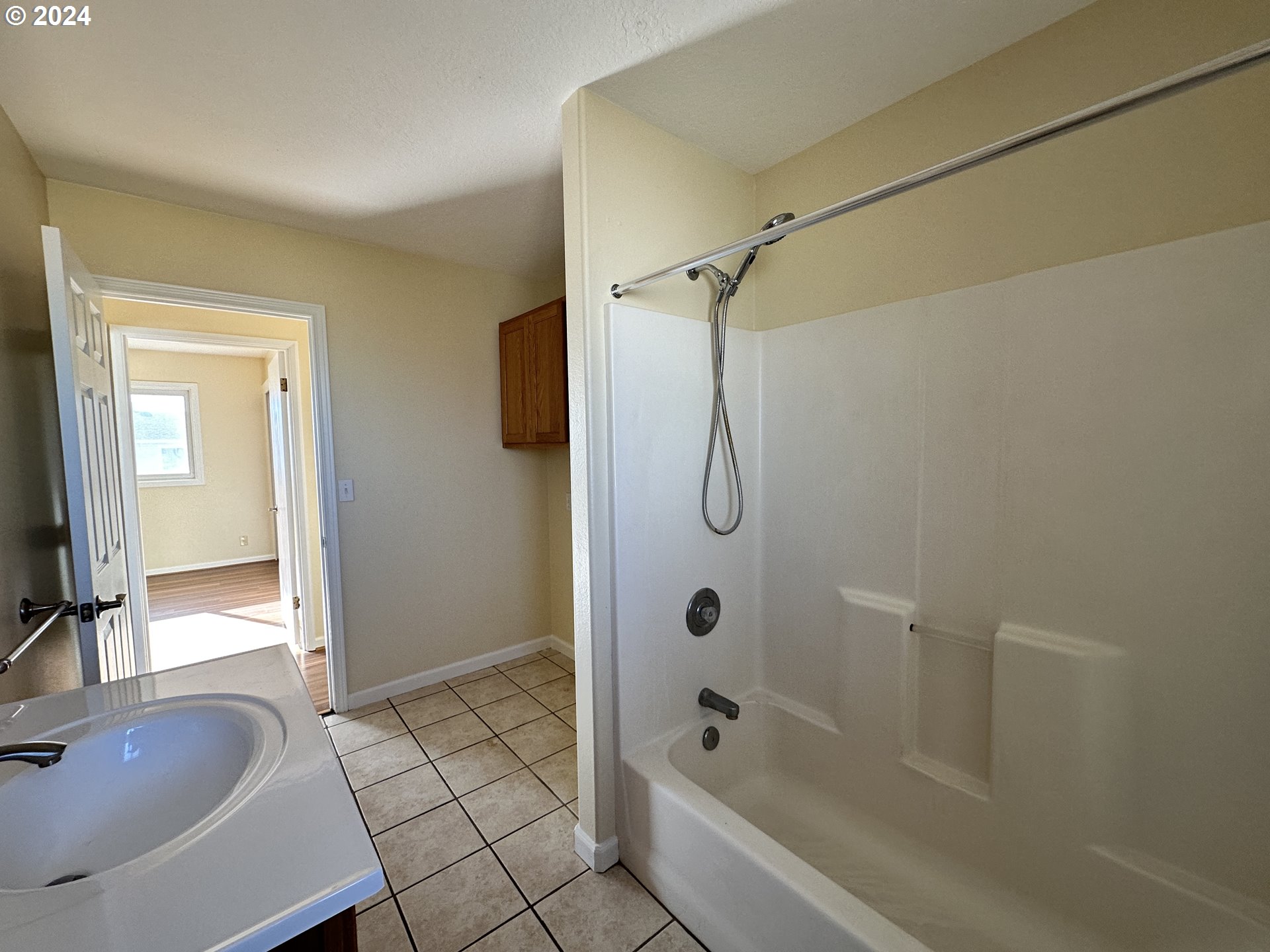 14865 Mount View Drive Condon, OR 97823 - Photo 14 of 23 a bathroom with a sink a mirror a bathtub and shower
