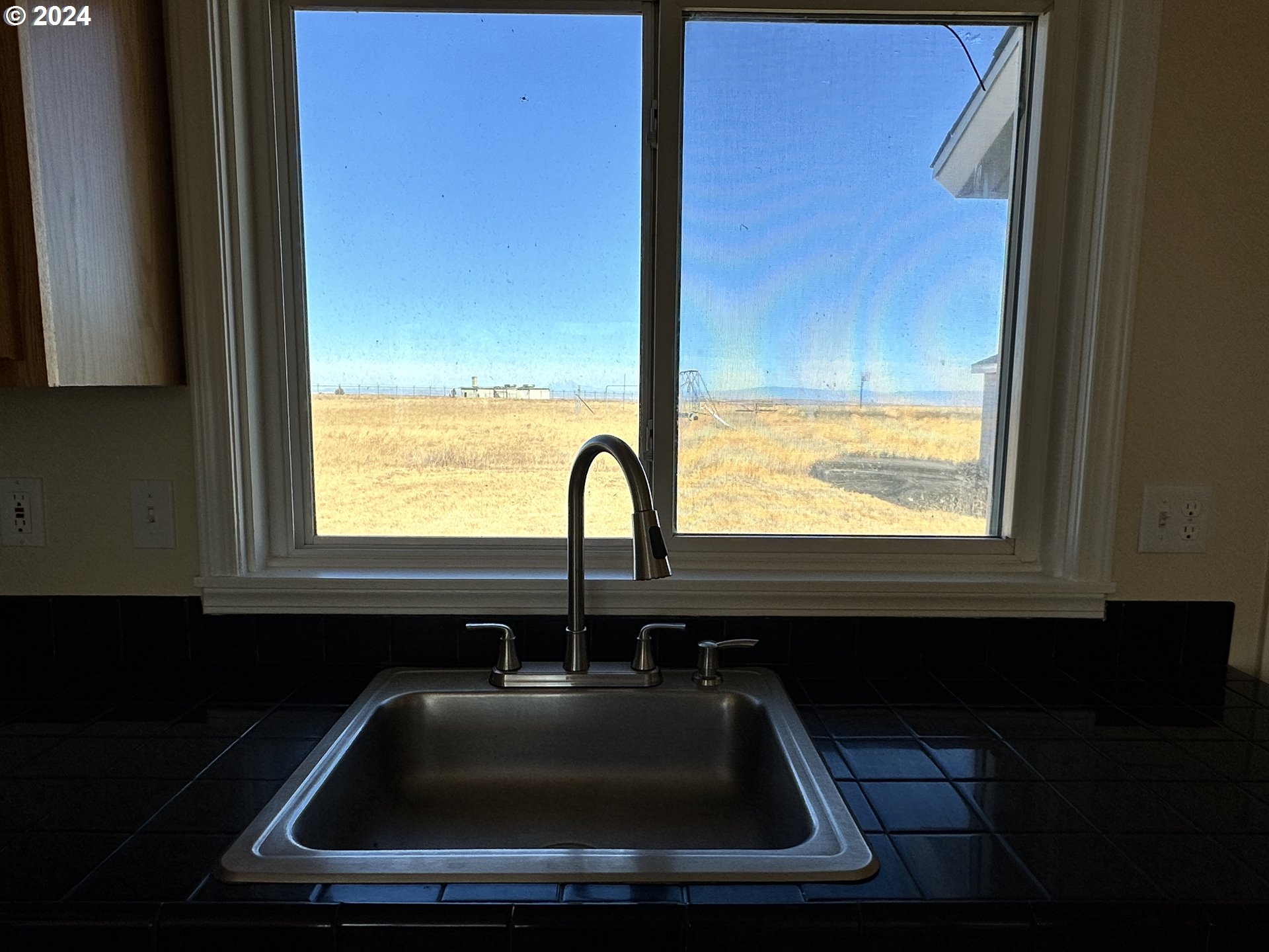 14865 Mount View Drive Condon, OR 97823 - Photo 23 of 23 a bathroom with a sink a window and a window