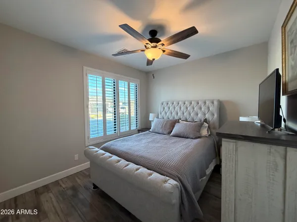 a bedroom with a bed and window