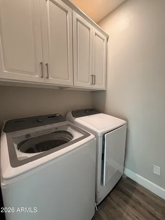 a bedroom with a bed and a television