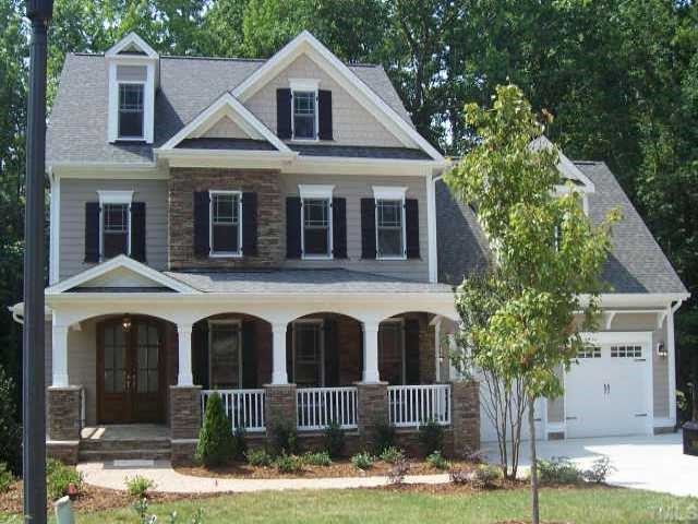 a front view of a house with yard