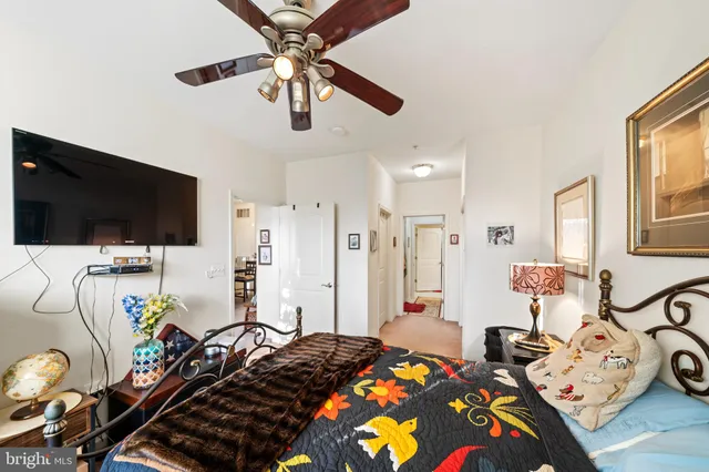 a view of a hallway with closet and bathroom
