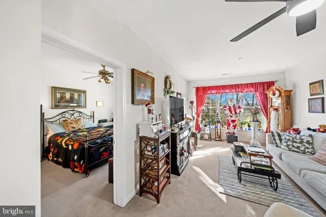 a bed room with a bed and a chandelier