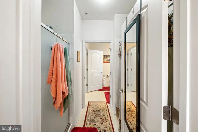 a view of a hallway with furniture and entryway