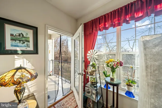 a view of a balcony with wooden floor