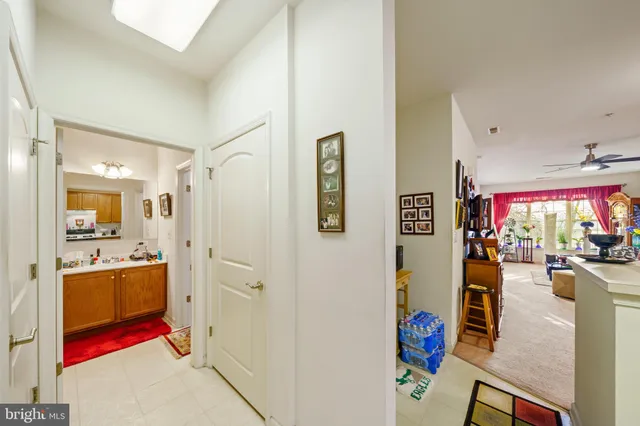 a kitchen that has a lot of cabinets in it and wooden floors