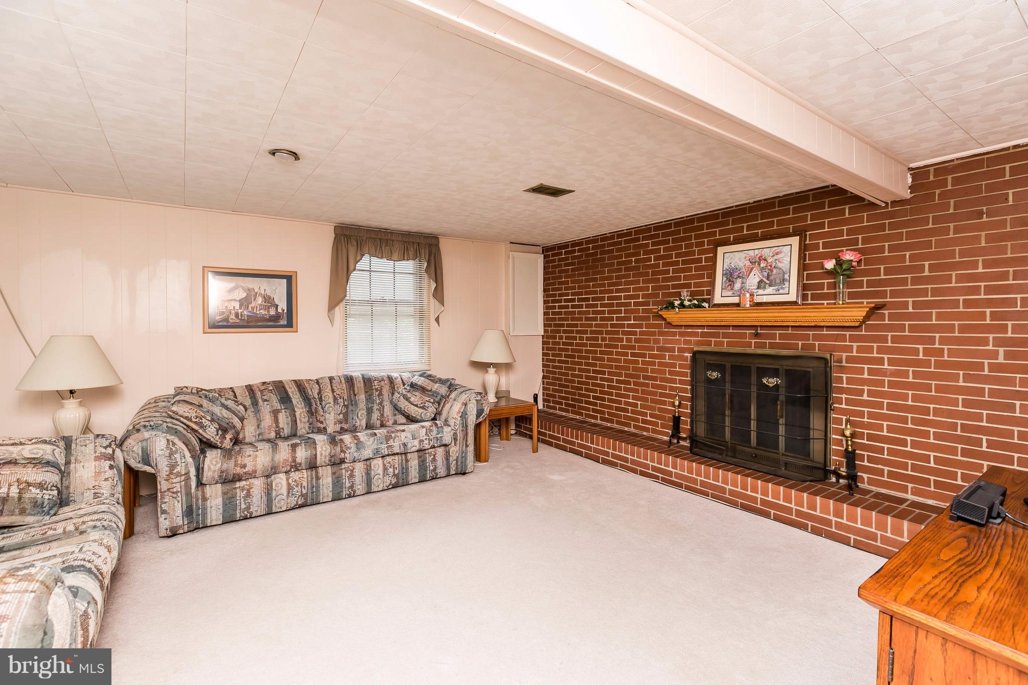 117 Northway Road Reisterstown, MD 21136 - Photo 6 of 25 WALKOUT LEVEL FAMILY ROOM W/FIREPLACE