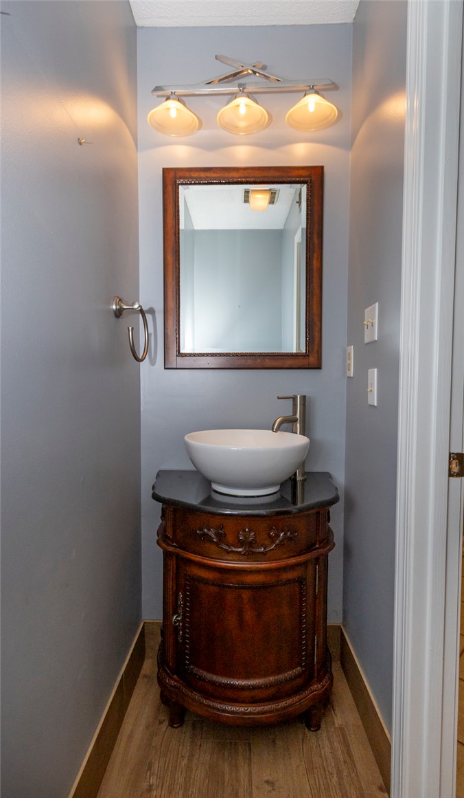 1302 Leeward Road Anderson, SC 29625 - Photo 29 of 50 A vessel sink vanity adds charm to this compact, well-lit powder room.