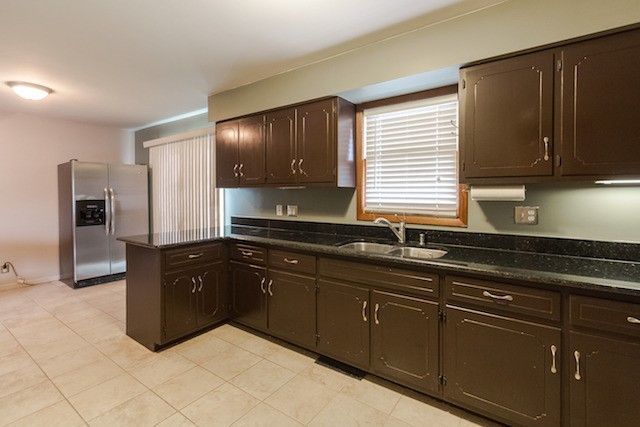 721 South Cooper Road New Lenox, IL 60451 - Photo 7 of 10 a kitchen with stainless steel appliances granite countertop a refrigerator and a sink